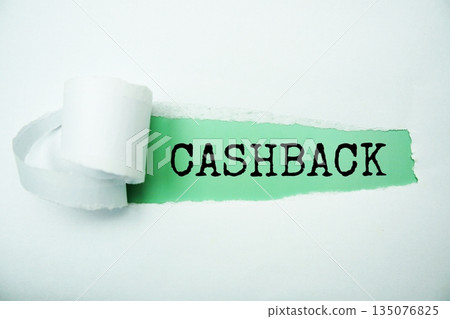 Cashback message written on green paper with torn paper background Cashback message written on green paper with torn paper background 135076825