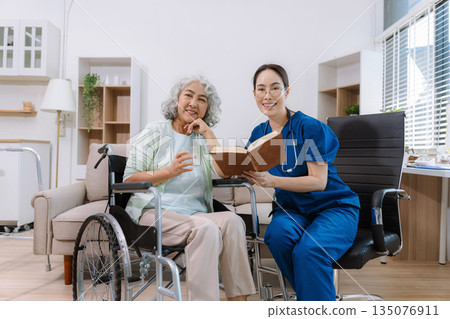 Elderly care concept. Portrait of nurse and her senior client on wheelchair. Elderly care concept. Portrait of nurse and her senior client on wheelchair. 135076911