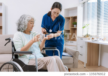 female therapist gives medication advice to a senior old patient in a medical clinic. therapy, wellness, and consultation visuals. female therapist gives medication advice to a senior old patient in a medical clinic. therapy, wellness, and consultation visuals. 135076912