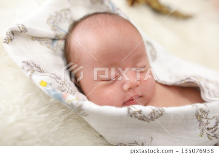 A sleeping baby wrapped in a swaddling cloth | Baby, newborn, and parenting images - Japan, advertising stock photos A sleeping baby wrapped in a swaddling cloth | Baby, newborn, and parenting images - Japan, advertising stock photos 135076938