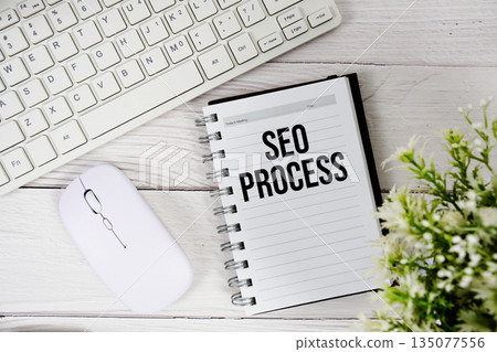 SEO Process text with keyboard and wireless mouse on wooden background 135077556