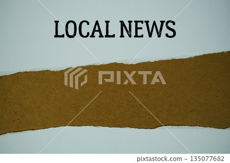 Local News text on paper craft with white paper torn ripped of horizontal 135077682