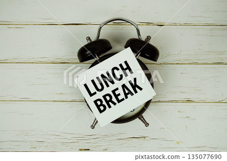 Lunch Break text with alarm clock on wooden background 135077690
