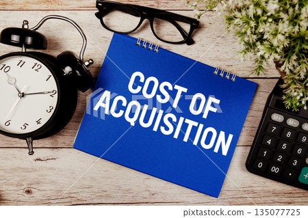 Cost Of Acquisition text with alarm clock and calculator on wooden background Cost Of Acquisition text with alarm clock and calculator on wooden background 135077725