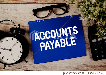 AP Accounts Payable text with alarm clock and calculator on wooden background AP Accounts Payable text with alarm clock and calculator on wooden background 135077732