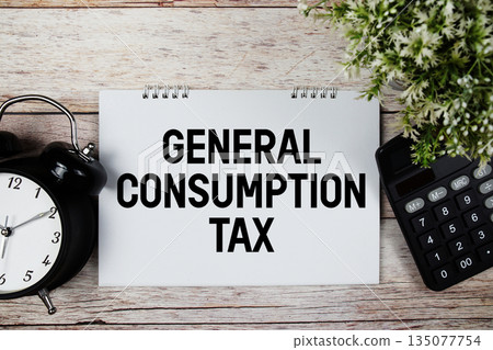 GCT General Consumption Tax text with alarm clock and calculator on wooden background GCT General Consumption Tax text with alarm clock and calculator on wooden background 135077754