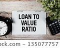 Loan to Value Ratio text with alarm clock and calculator on wooden background 135077757