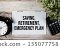 Saving, Retirement, Emergency Plan text with alarm clock and calculator on wooden background 135077758