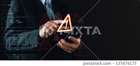 businessman in a suit uses a smartphone with floating warning icons and digital code overlay, symbolizing cybersecurity threats, system vulnerabilities, caution alerts, and digital risk awareness. 135078175