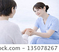 Image of a nurse caring for a patient 135078267