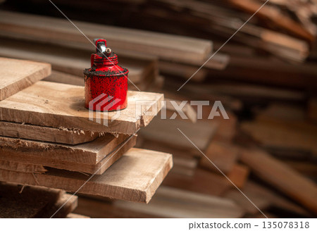 Oil Can Rusty On a Timber Plank 135078318