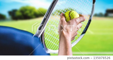 Cropped image of female player holding tennis racket 135078526