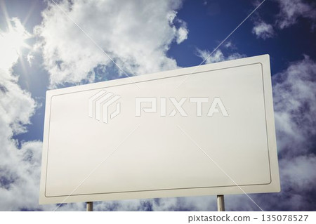 White billboard against cloudy sky 135078527