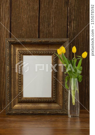 Photo frame and camera on table 135078592