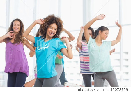 Flat design illustration is depicting five women dancing in sunlit studio, with Zumba logo Flat design illustration is depicting five women dancing in sunlit studio, with Zumba logo 135078759