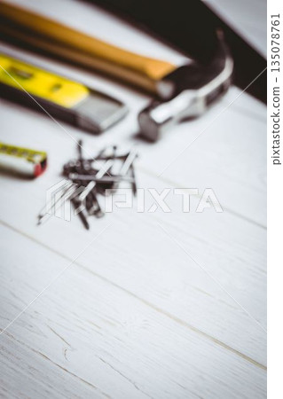 Flat illustration is showing claw hammer lying on white plank with nails and tools, copy space Flat illustration is showing claw hammer lying on white plank with nails and tools, copy space 135078761