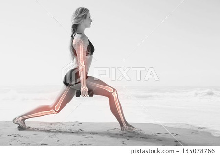 Highlighted bones of woman holding dumbbells 135078766