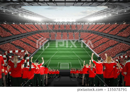 Vast football stadium with fans in red Vast football stadium with fans in red 135078791