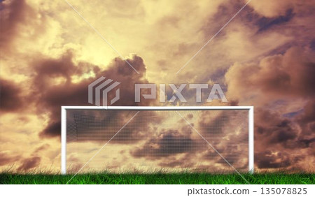 Football goal under cloudy sky Football goal under cloudy sky 135078825