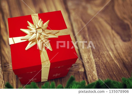 Red gift box is sitting on wooden tabletop in flat-design, with gold ribbon and pine branches 135078906