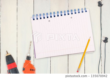 Tools and tablet on wooden background Tools and tablet on wooden background 135078942