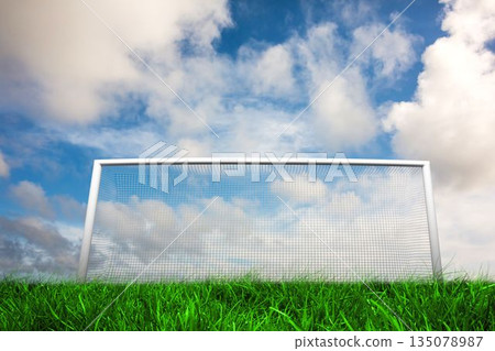 Football goal under blue cloudy sky Football goal under blue cloudy sky 135078987