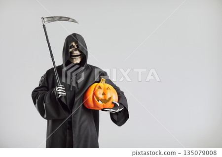 Halloween Death man with jack o lantern pumpkin, Grim Reaper cosplay costume with scythe, scary man 135079008