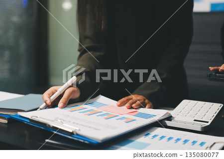 business people in meeting discussing plans together business people in meeting discussing plans together 135080077