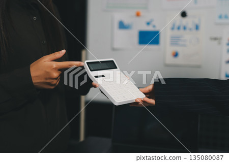 business people in meeting discussing plans together business people in meeting discussing plans together 135080087
