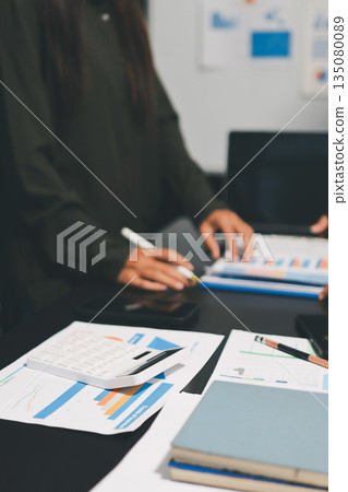 business people in meeting discussing plans together business people in meeting discussing plans together 135080089