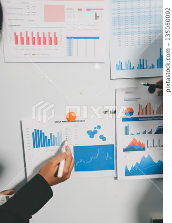 business people in meeting discussing plans together 135080092