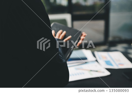 business people in meeting discussing plans together business people in meeting discussing plans together 135080093