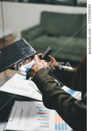 business people in meeting discussing plans together business people in meeting discussing plans together 135080094