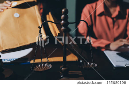Consultation and conference of professional businesswoman and Male lawyers working and discussion having at law firm in office. Concepts of law, Judge gavel with scales of justice Consultation and conference of professional businesswoman and Male lawyers working and discussion having at law firm in office. Concepts of law, Judge gavel with scales of justice 135080106