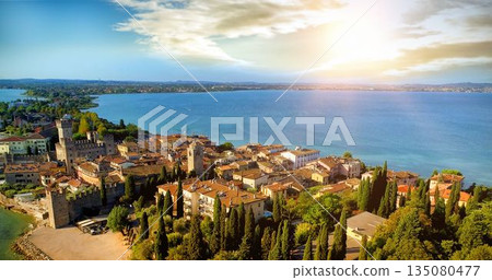 Sky view of a village in front of the sea Sky view of a village in front of the sea 135080477