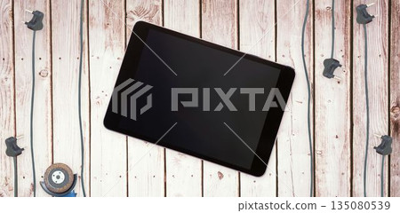 Tablet pc on wooden surface Tablet pc on wooden surface 135080539