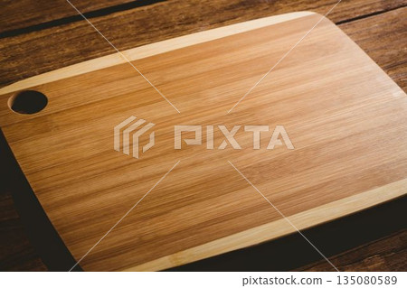 Chopping board on wooden flooring Chopping board on wooden flooring 135080589