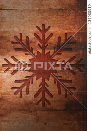 Rustic flat design is showing reddish brown snowflake motif on weathered wooden planks with knots Rustic flat design is showing reddish brown snowflake motif on weathered wooden planks with knots 135080919