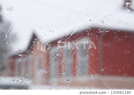 Raindrops on the window glass, Icy flowers - frozen window Raindrops on the window glass, Icy flowers - frozen window 135081190
