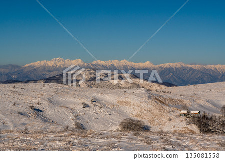 Snowy scenery of the Northern Alps from the snowy promenade of Kirigamine Plateau 135081558
