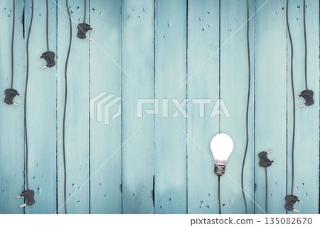 Plugs on wooden background 135082670