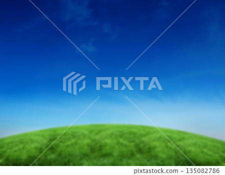 Grassy hill against blue sky Grassy hill against blue sky 135082786