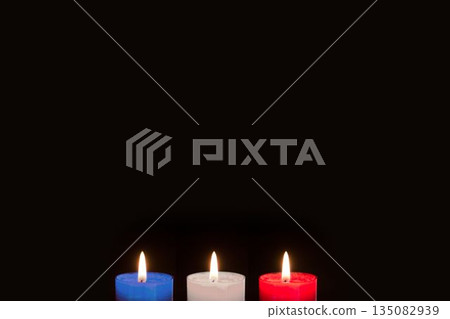 Candles on black background Candles on black background 135082939