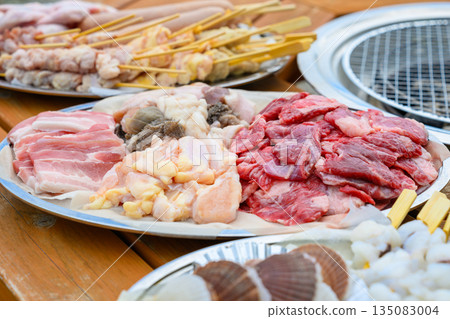 Preparing meat and skewers for yakiniku (Photo courtesy of Oki Seaside Resort Miyabi) Preparing meat and skewers for yakiniku (Photo courtesy of Oki Seaside Resort Miyabi) 135083004