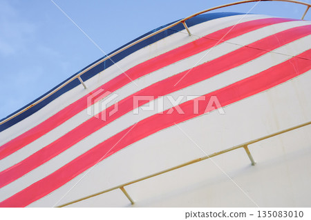 The side of a ship and blue sky The side of a ship and blue sky 135083010
