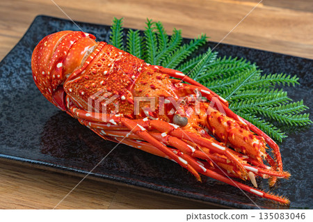 Delicious stewed lobster served on a black square plate 135083046