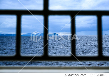 The sea seen from the ship's window The sea seen from the ship's window 135083069