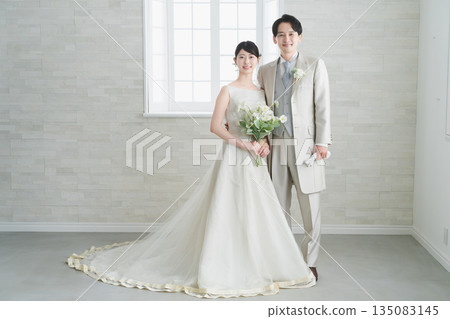 Bride in a dress and groom in a tuxedo Wedding image Bride in a dress and groom in a tuxedo Wedding image 135083145
