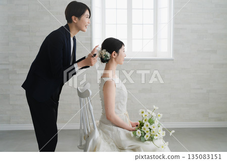 Bride having her hair and makeup done Wedding image Bride having her hair and makeup done Wedding image 135083151