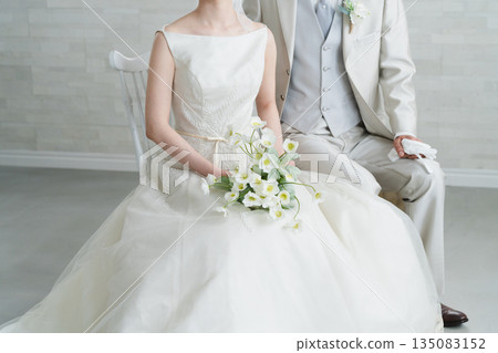 Bride in a dress and groom in a tuxedo Wedding image Bride in a dress and groom in a tuxedo Wedding image 135083152